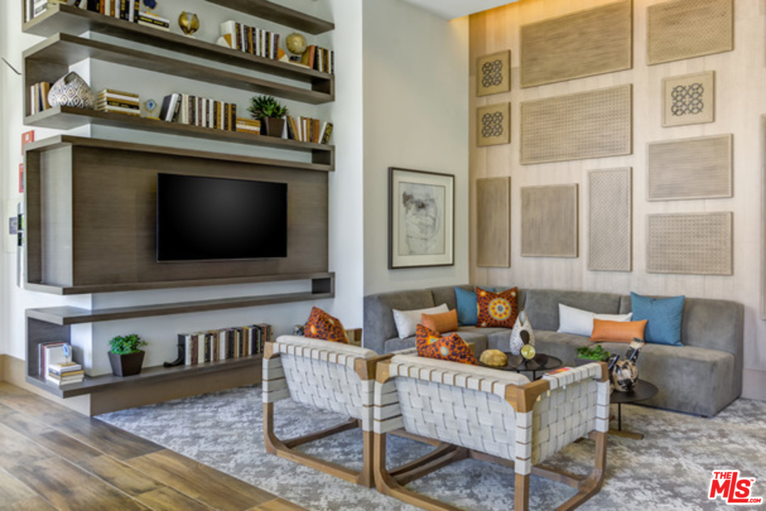 75 West Walnut Street, Unit 434 Pasadena, CA 91103 - Photo 17 of 22 a living room with furniture and a flat screen tv