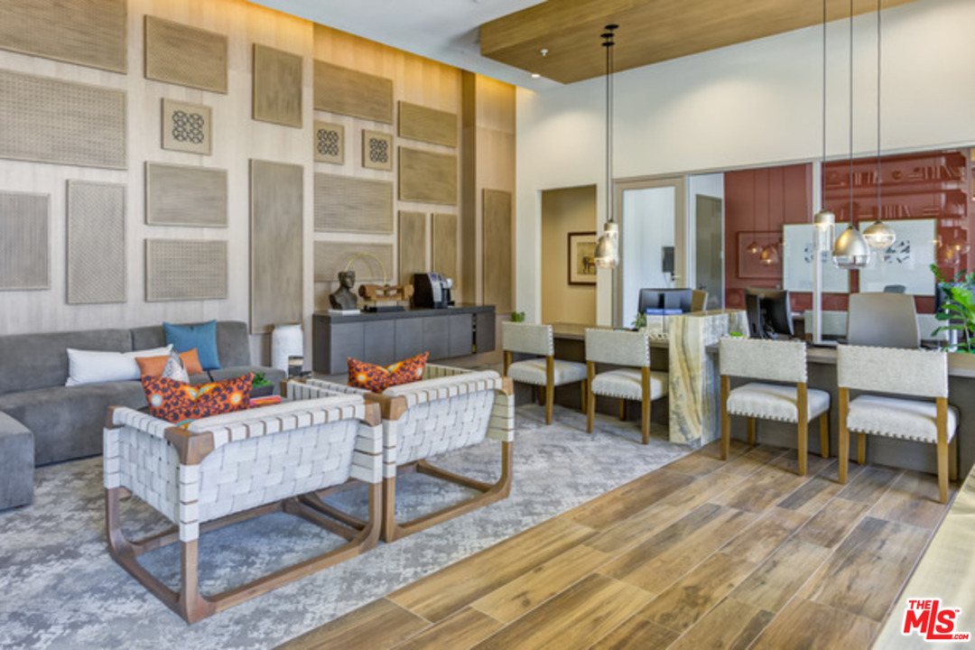 75 West Walnut Street, Unit 434 Pasadena, CA 91103 - Photo 18 of 22 a living room with furniture and a floor to ceiling window