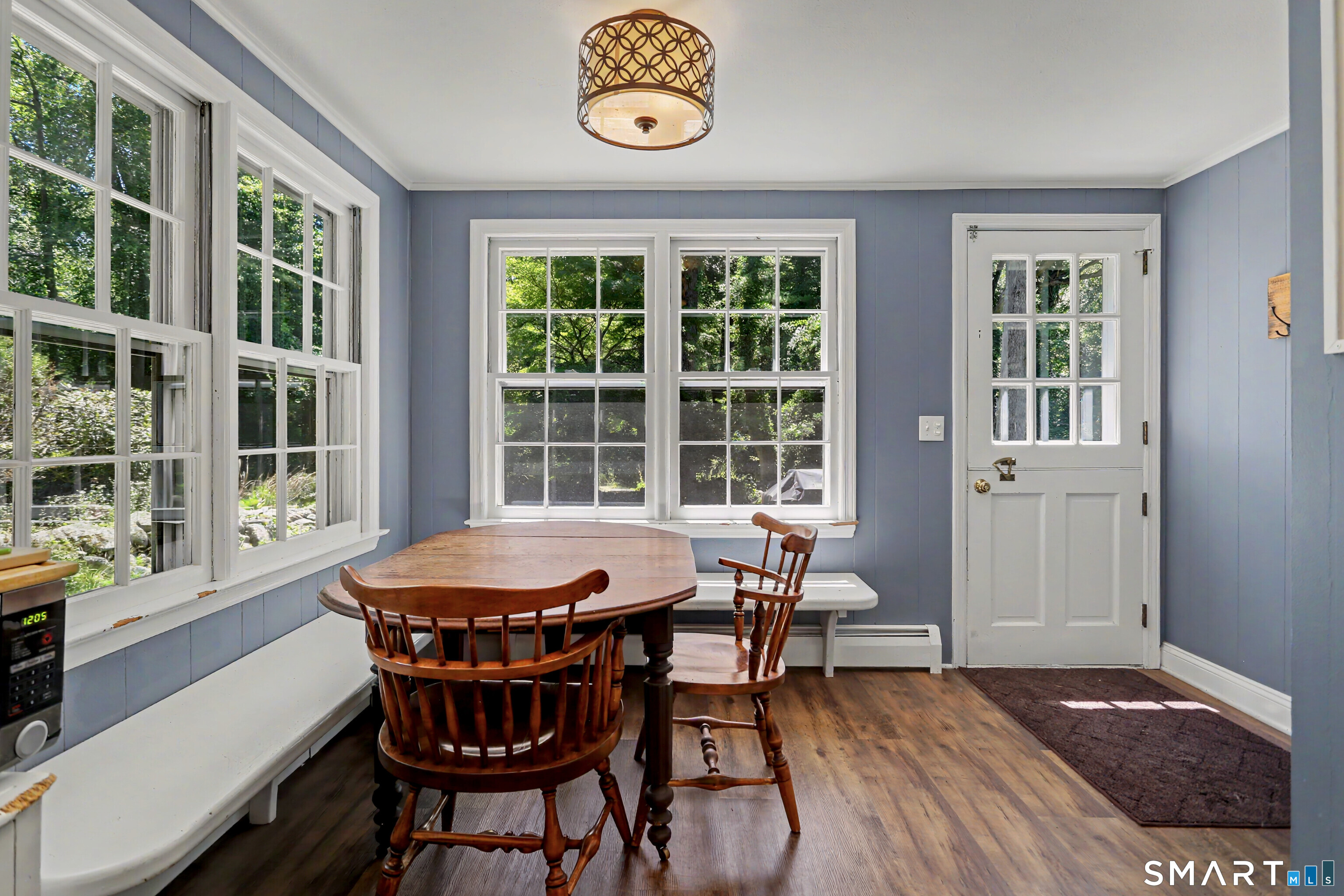 31 Vista Road Wilton, CT 06897 - Photo 11 of 34 Bright eat-in kitchen with beautiful backyard views, abundant natural light, and the perfect setting for casual dining.
