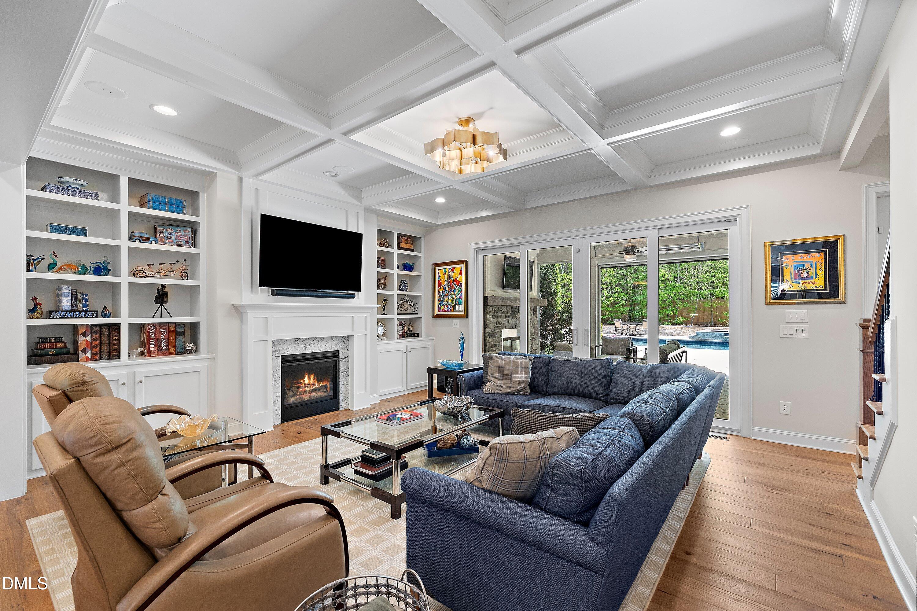 1536 Rock Dove Way Raleigh, NC 27614 - Photo 15 of 100 a living room with furniture a fireplace and a flat screen tv