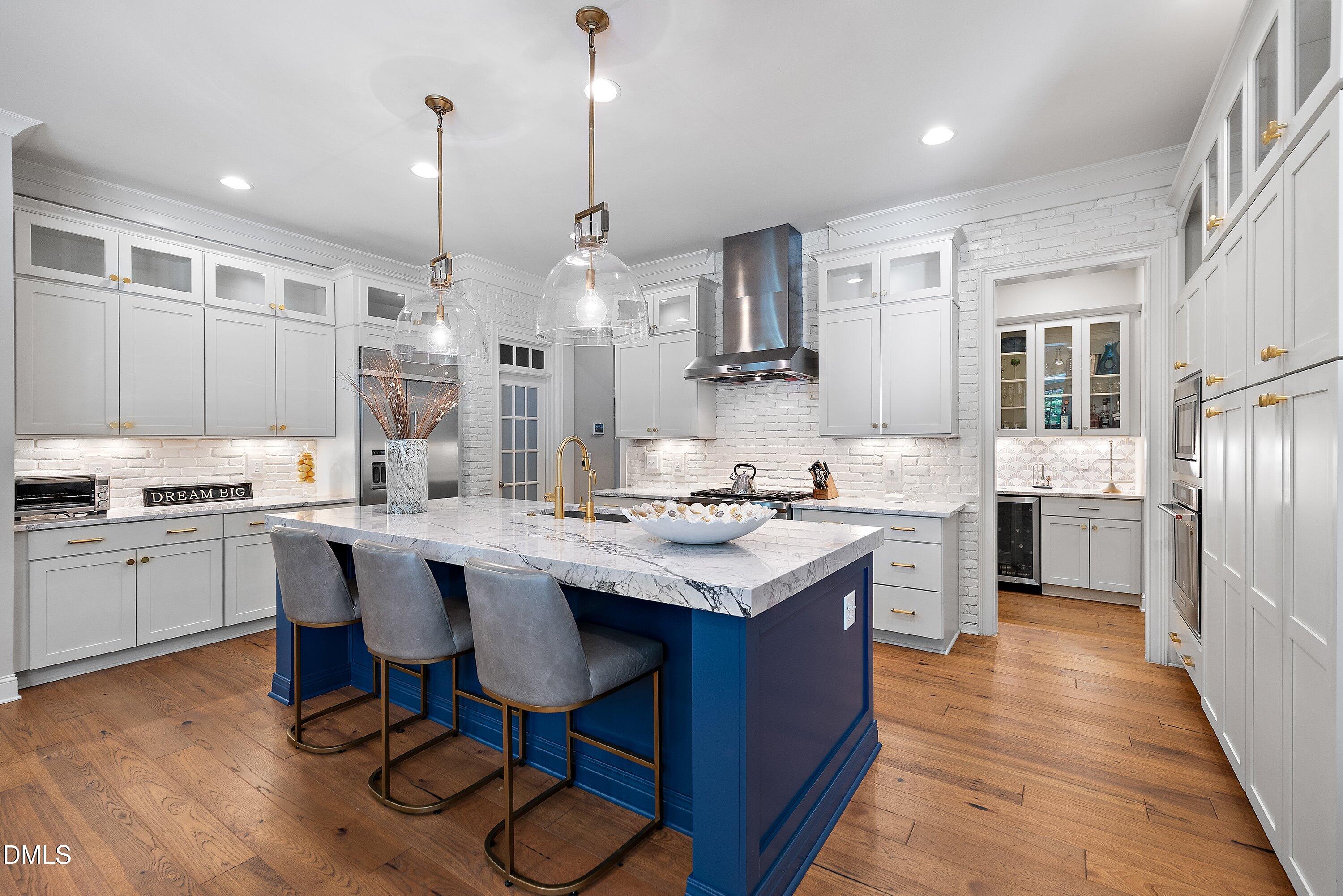 1536 Rock Dove Way Raleigh, NC 27614 - Photo 21 of 100 a kitchen with stainless steel appliances granite countertop a sink a stove and a refrigerator
