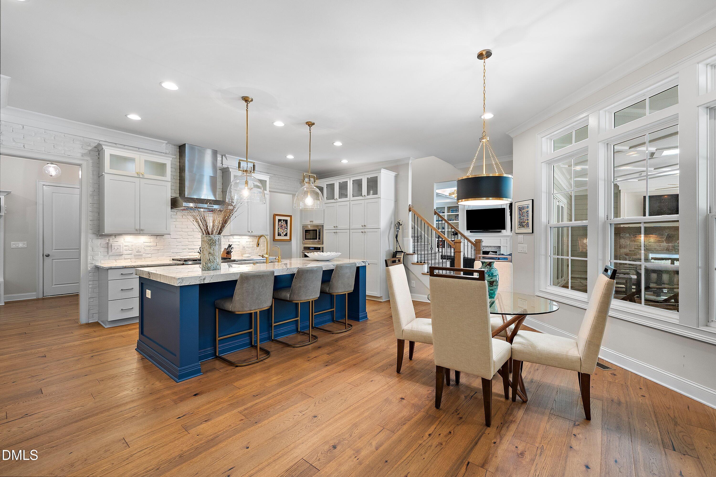 1536 Rock Dove Way Raleigh, NC 27614 - Photo 32 of 100 a large kitchen with a table and chairs