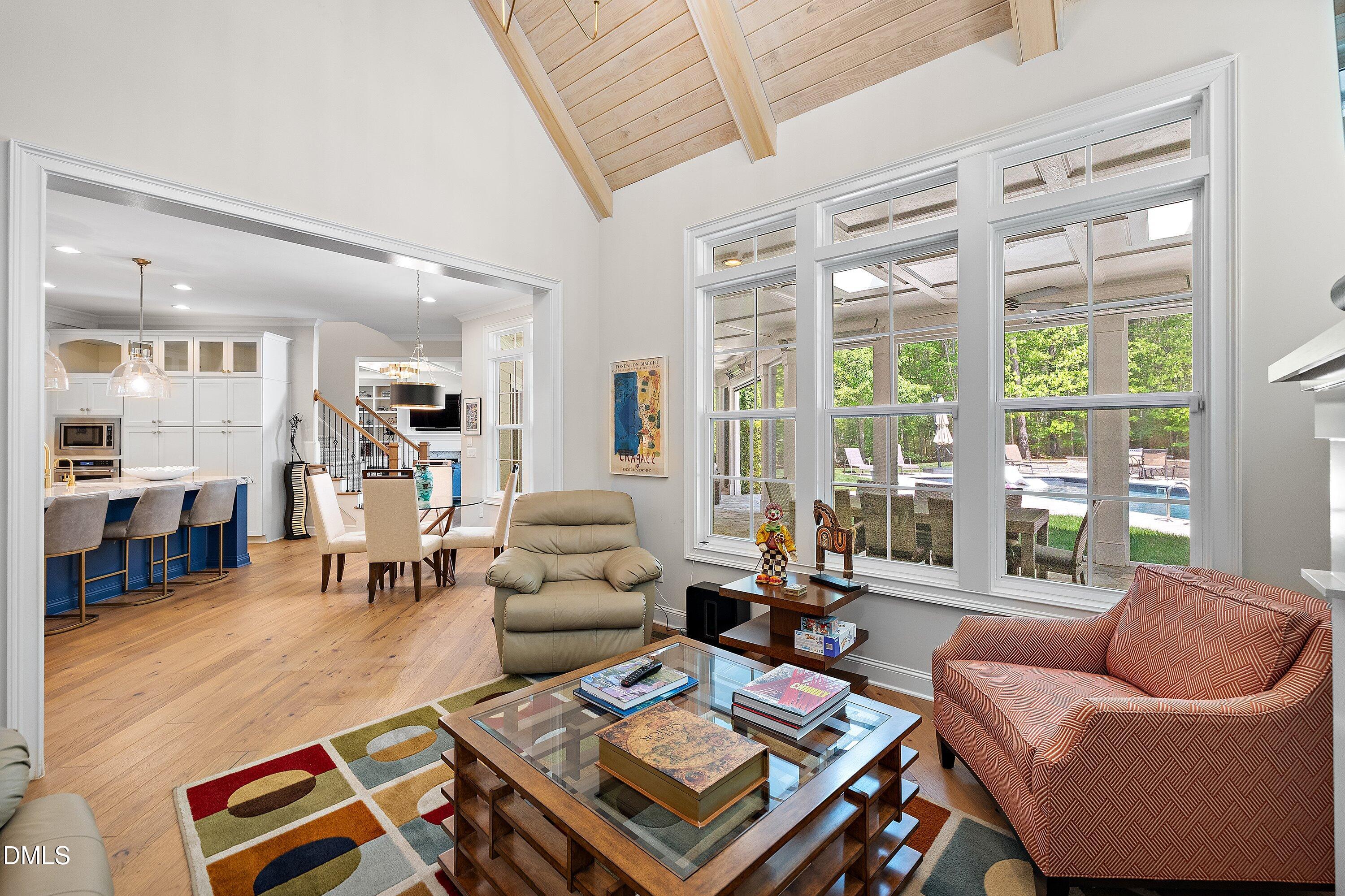 1536 Rock Dove Way Raleigh, NC 27614 - Photo 37 of 100 a living room with furniture a rug and a large window