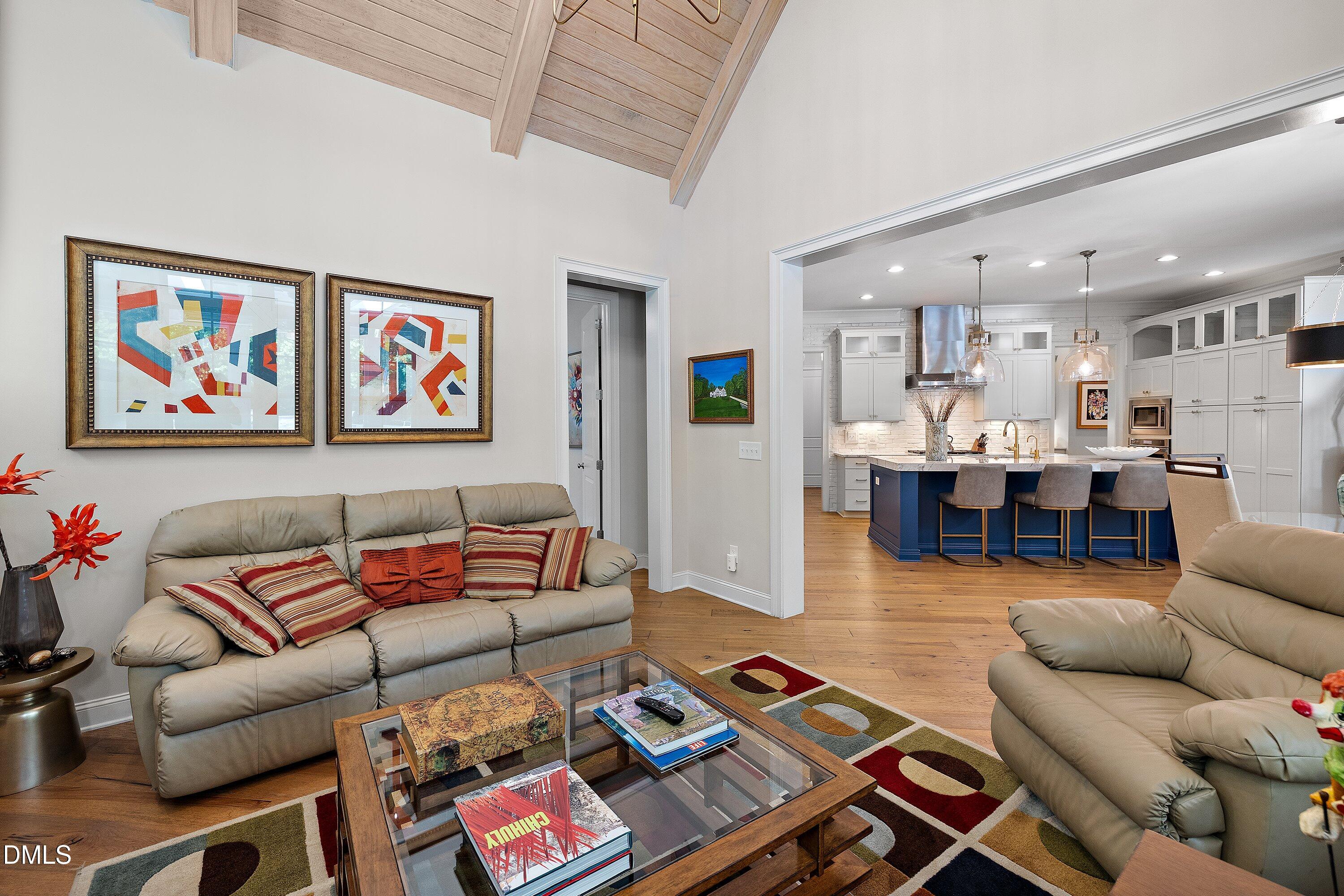 1536 Rock Dove Way Raleigh, NC 27614 - Photo 38 of 100 a living room with furniture a table and kitchen view