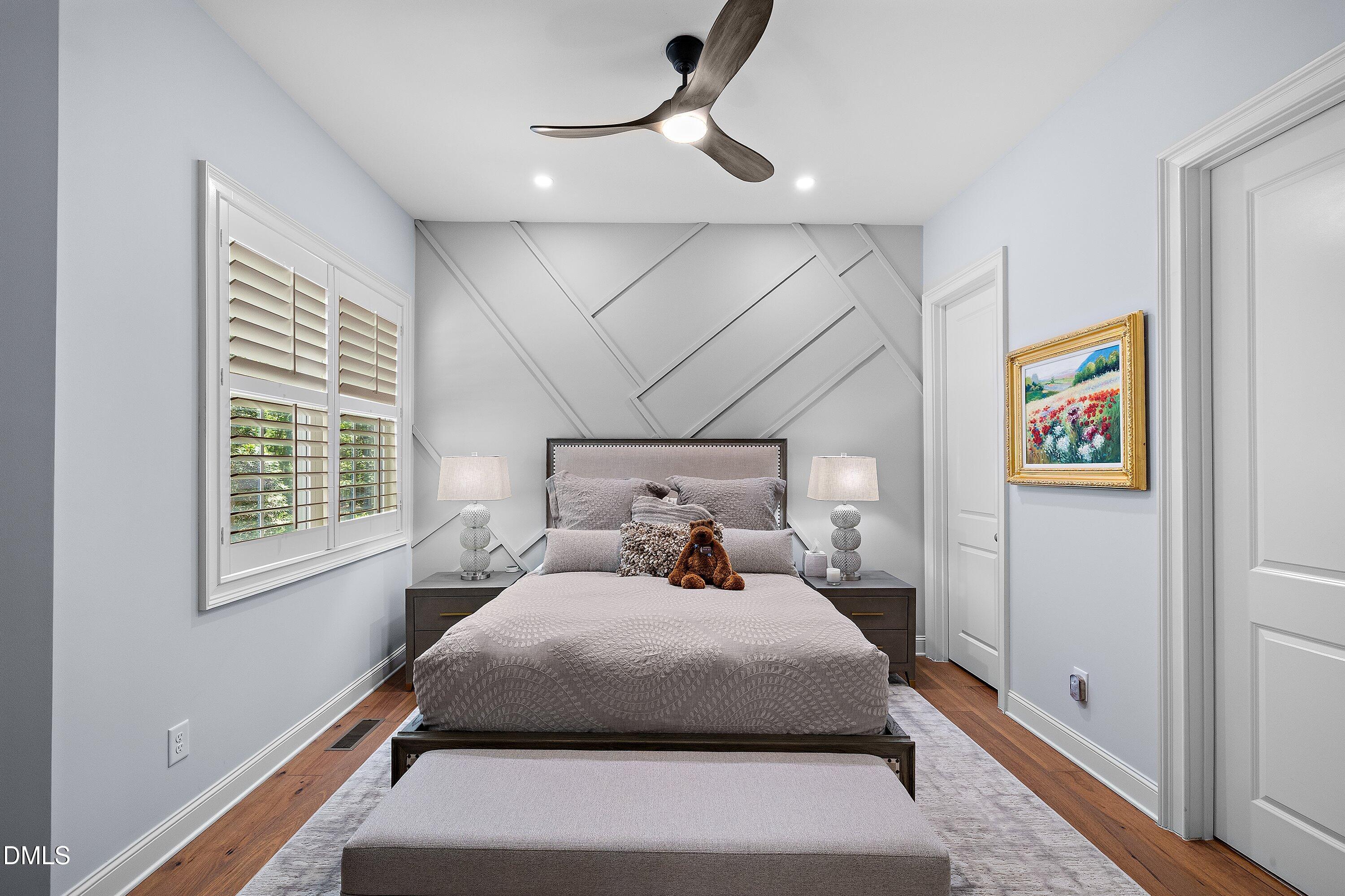 1536 Rock Dove Way Raleigh, NC 27614 - Photo 39 of 100 a bedroom with a large bed and a chandelier