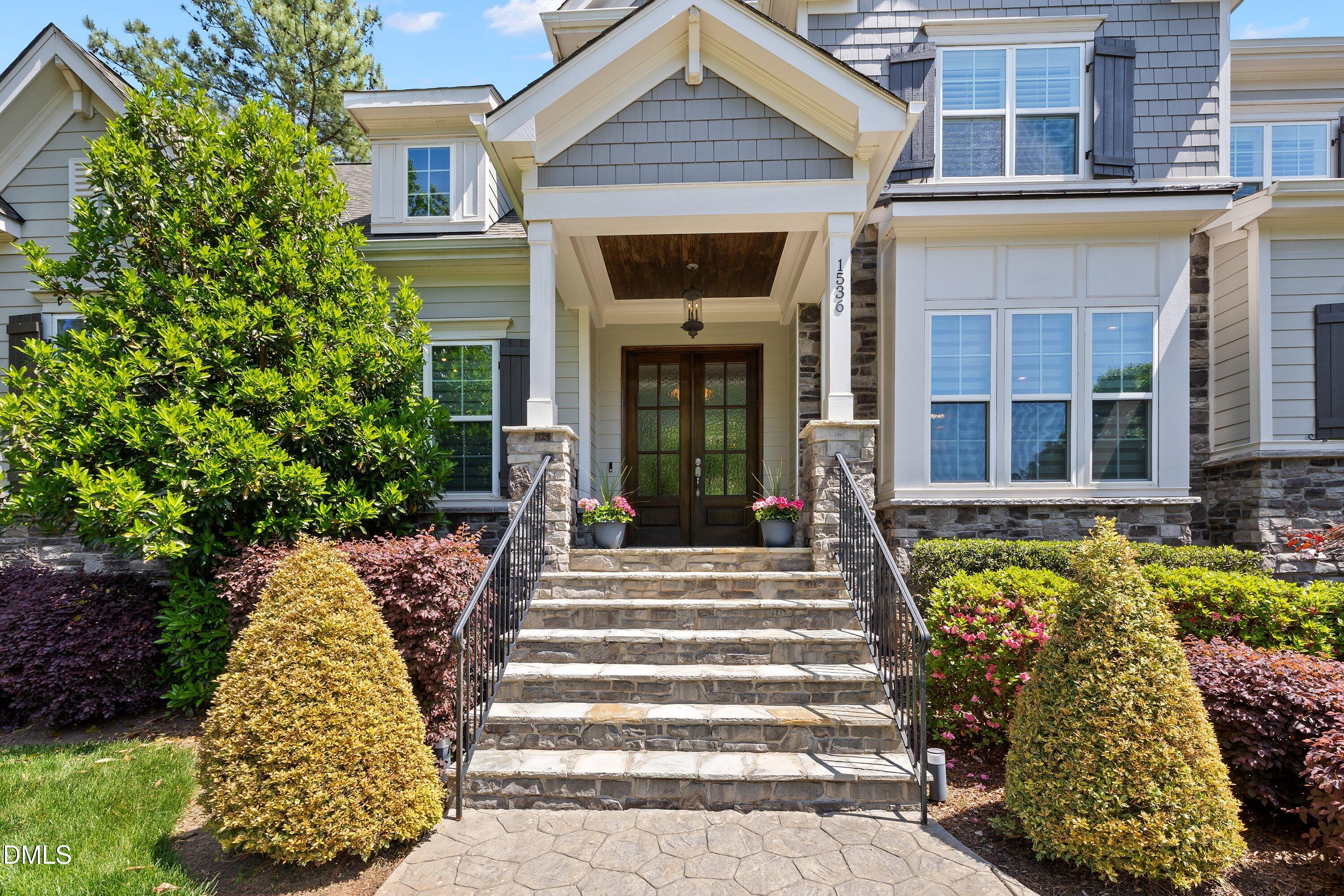 1536 Rock Dove Way Raleigh, NC 27614 - Photo 4 of 100 a front view of a house with a garden
