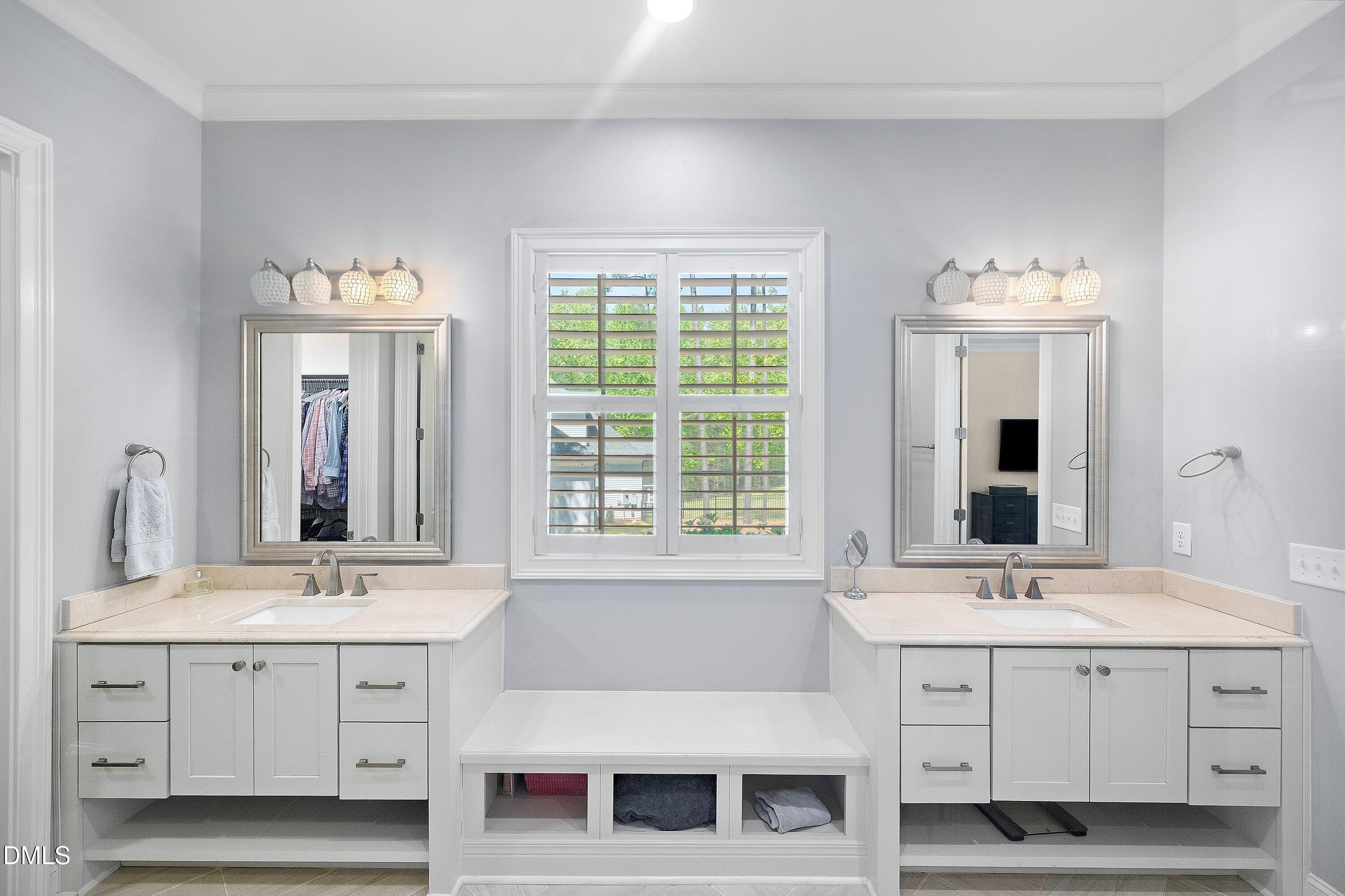 1536 Rock Dove Way Raleigh, NC 27614 - Photo 57 of 100 a bathroom with a sink double vanity and a mirror
