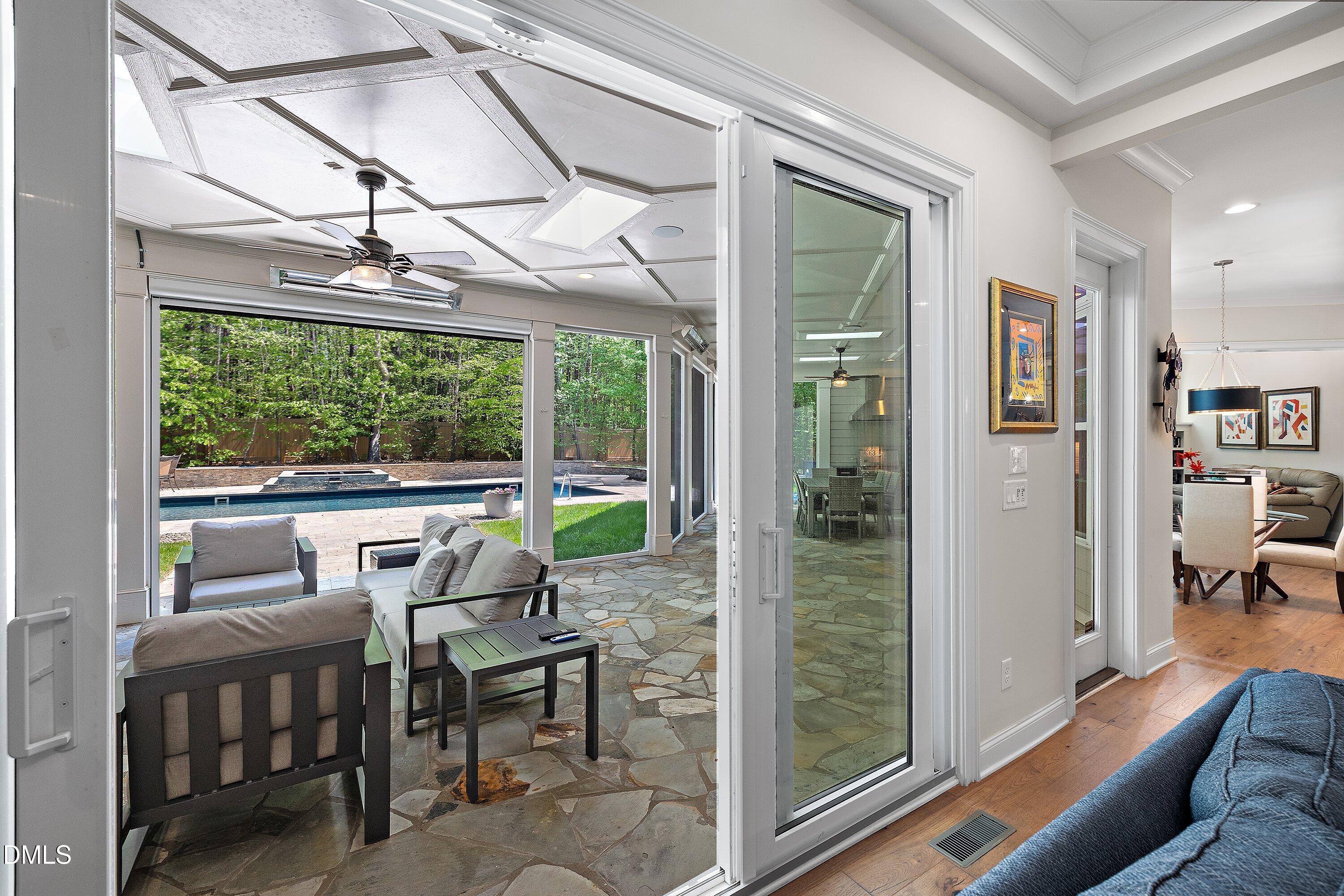 1536 Rock Dove Way Raleigh, NC 27614 - Photo 58 of 100 a view of a dining room with furniture large windows and wooden floor