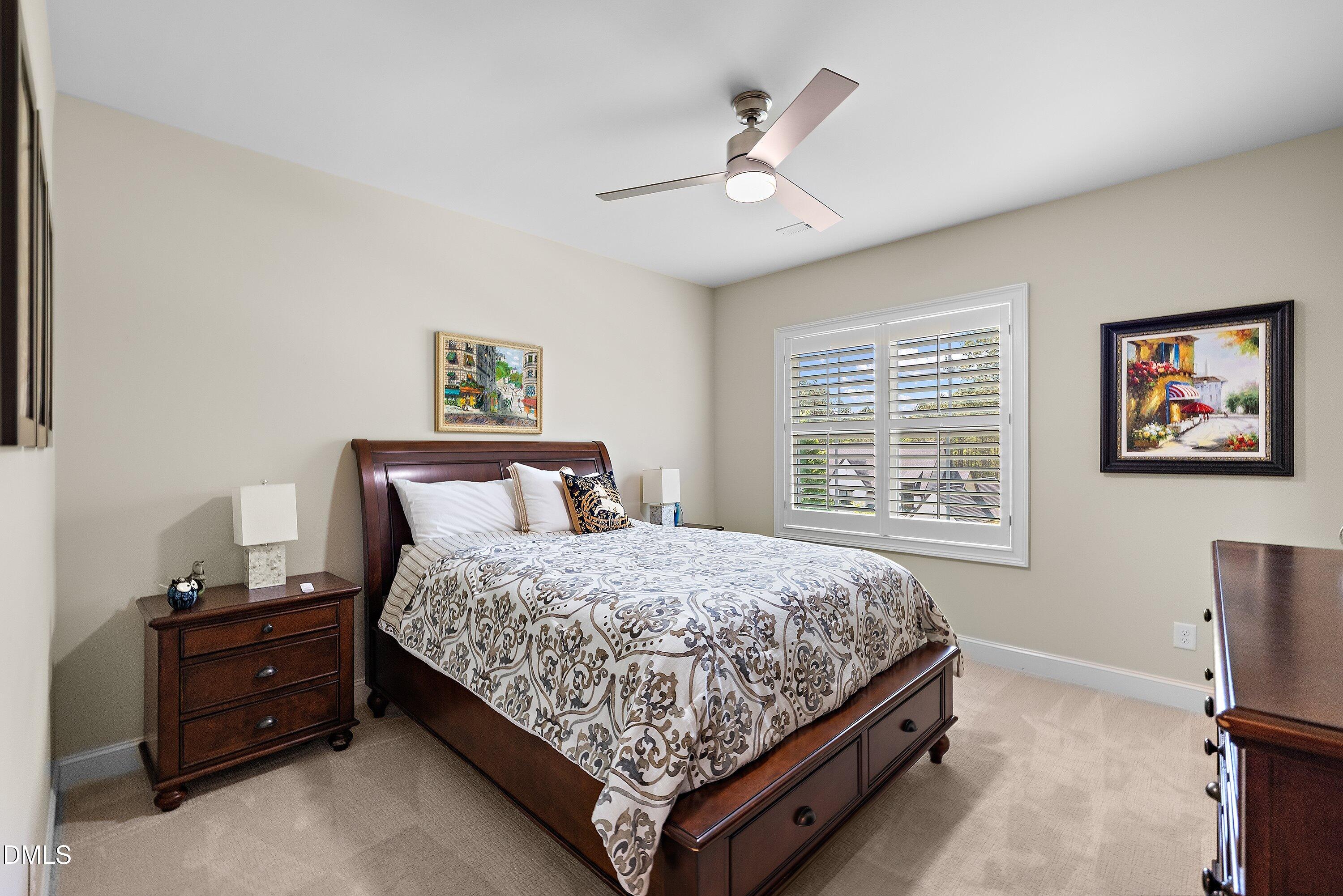 1536 Rock Dove Way Raleigh, NC 27614 - Photo 75 of 100 a bedroom with a bed dresser and window