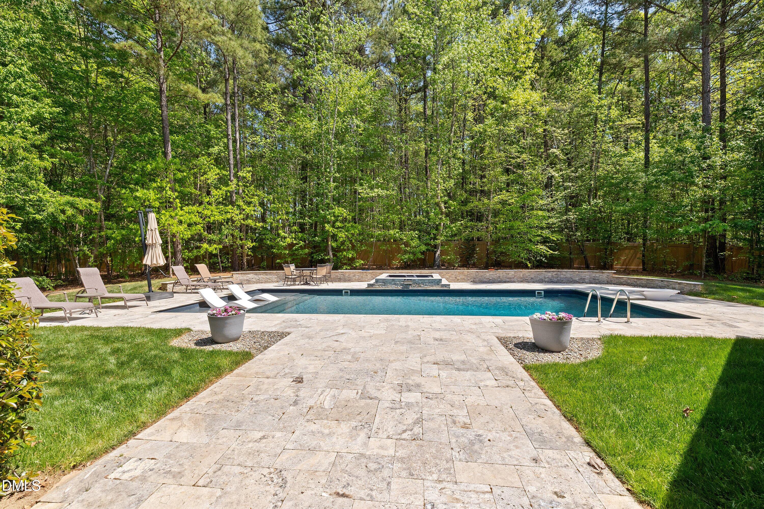1536 Rock Dove Way Raleigh, NC 27614 - Photo 82 of 100 a view of backyard with swimming pool and seating space