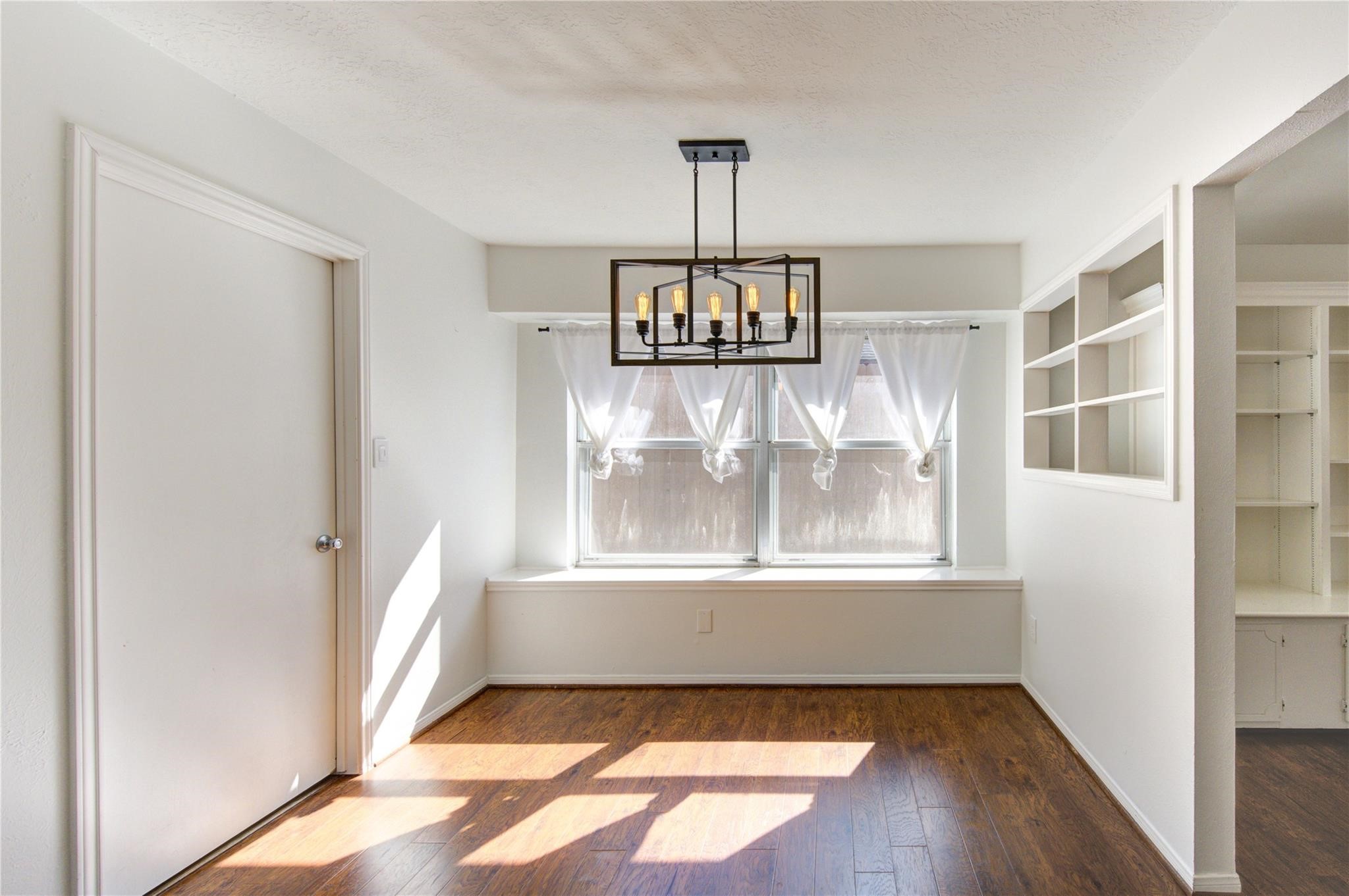 29115 Raestone Street Spring, TX 77386 - Photo 13 of 40 an empty room with windows and outdoor view