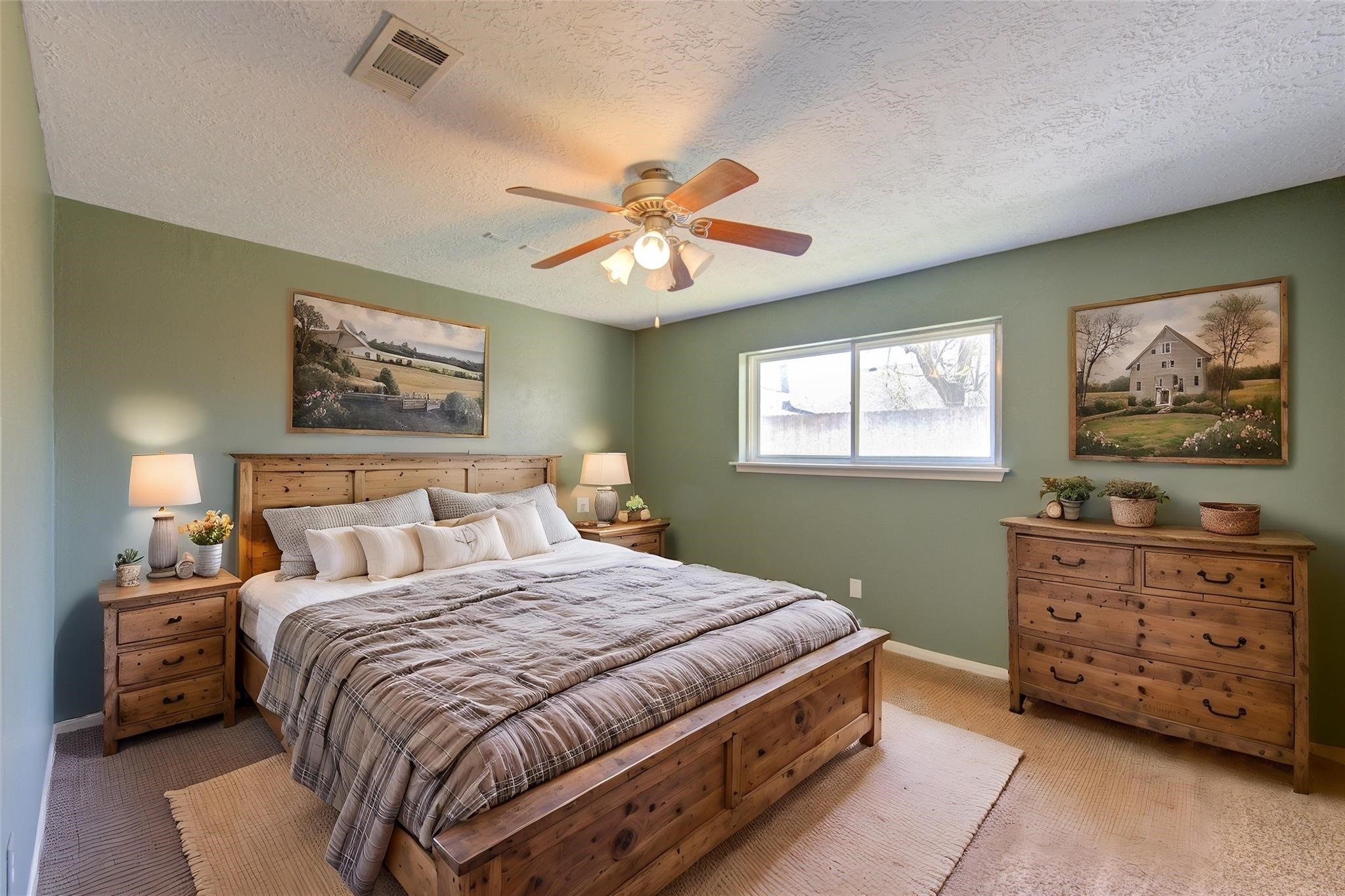 29115 Raestone Street Spring, TX 77386 - Photo 20 of 40 a bedroom with a bed and a painting on the wall