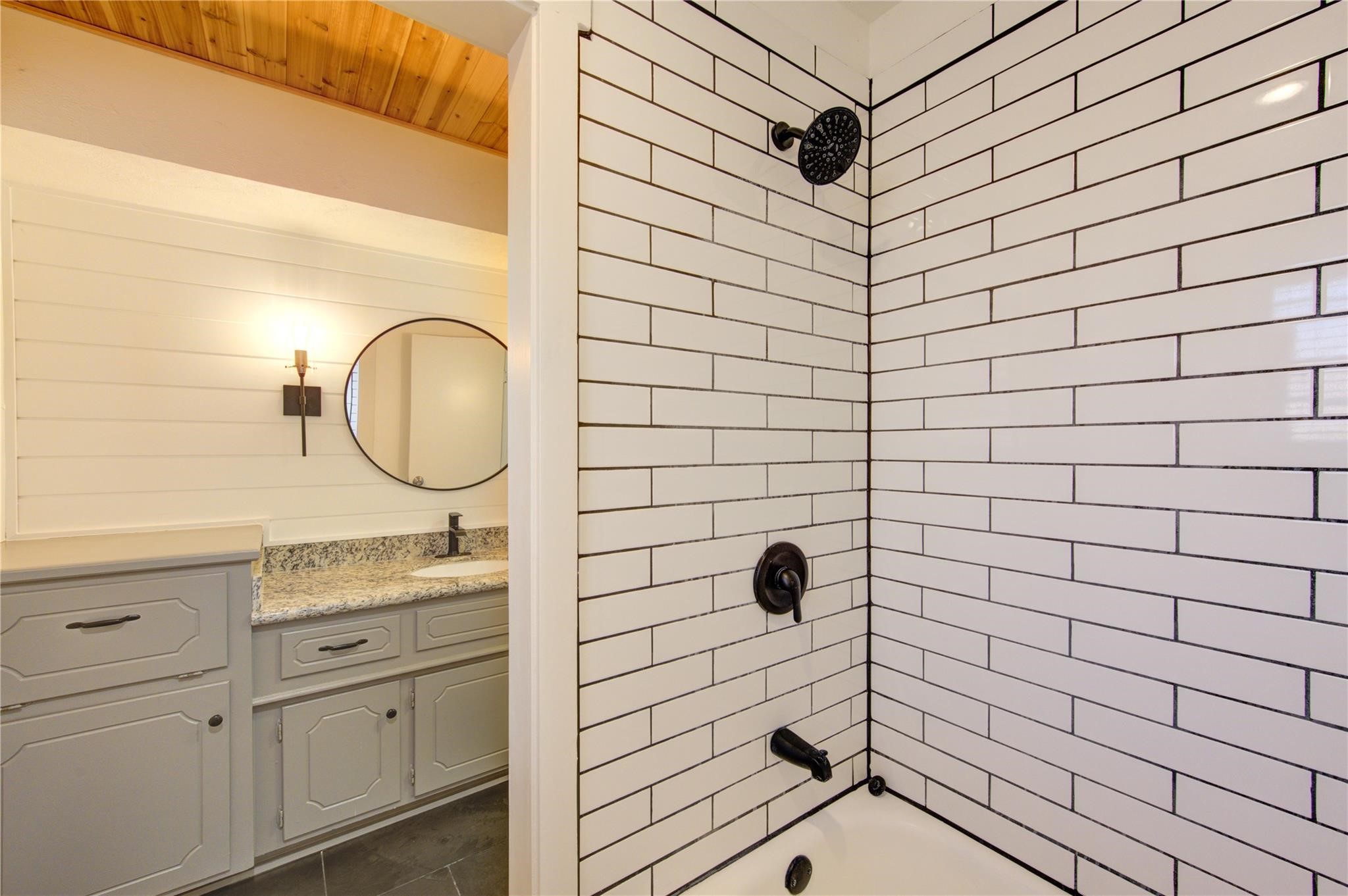 29115 Raestone Street Spring, TX 77386 - Photo 30 of 40 a bathroom with a sink a mirror and shower