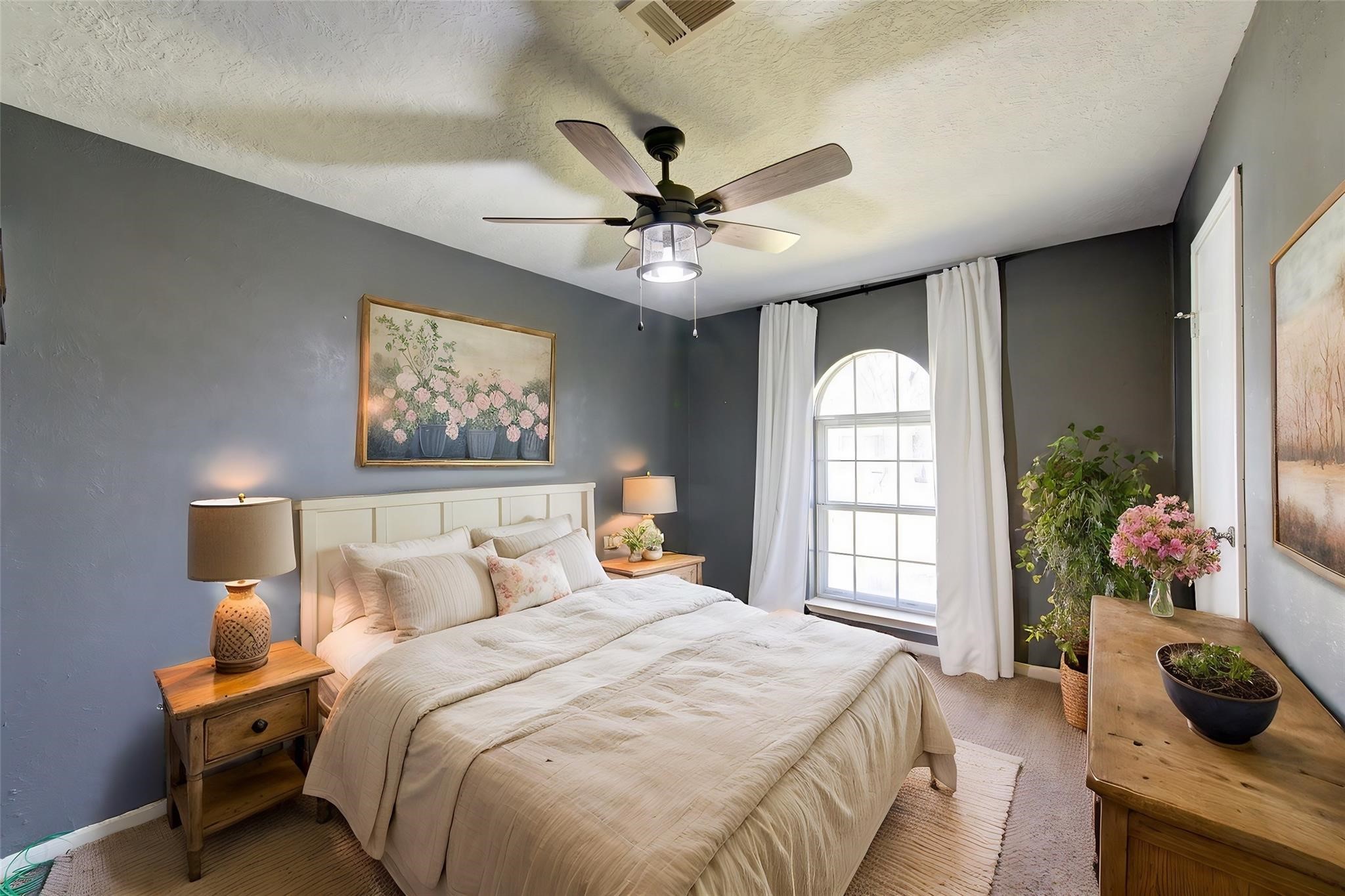 29115 Raestone Street Spring, TX 77386 - Photo 31 of 40 a bedroom with a balcony a bed and a chandelier