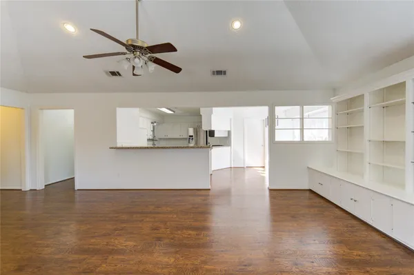 a view of a dining room with furniture and a table