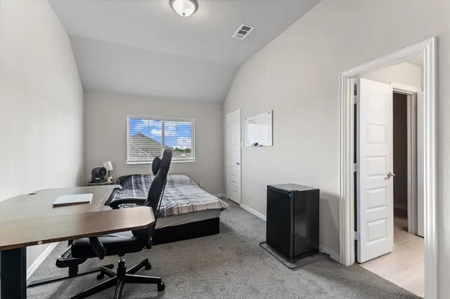 a view of a workspace with furniture