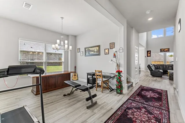 a view of a livingroom with workspace and a couch