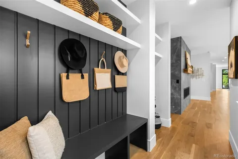 a view of hallway with wooden floor