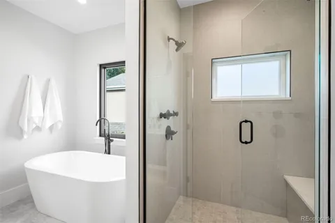 a white bath tub sitting next to a white sink