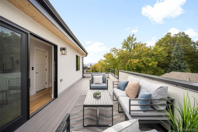 a view from deck having patio