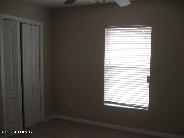 7660 Ranchette Road Keystone Heights, FL 32656 - Photo 5 of 14 a view of a room that has a window in it
