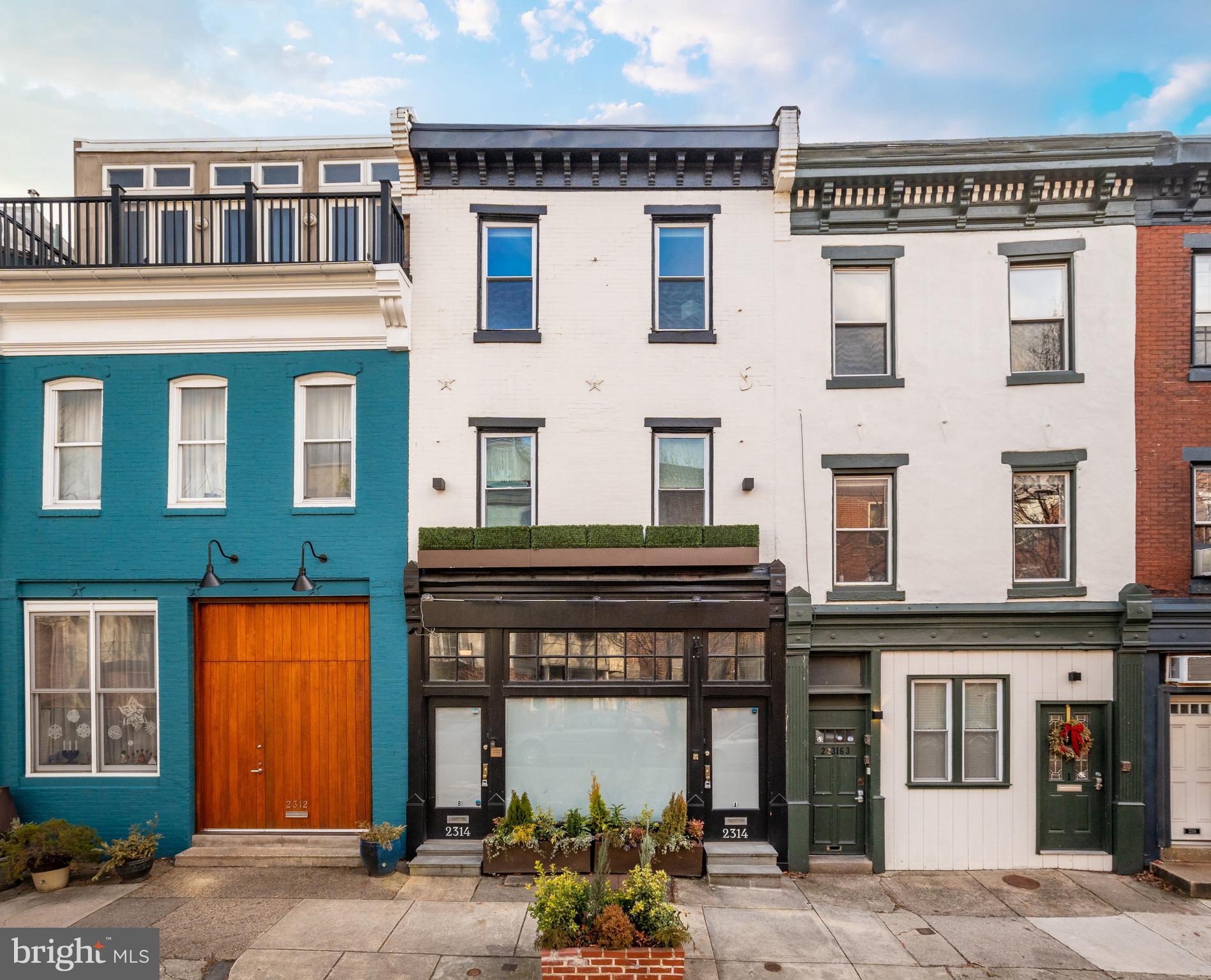 a front view of a building with a lot of windows