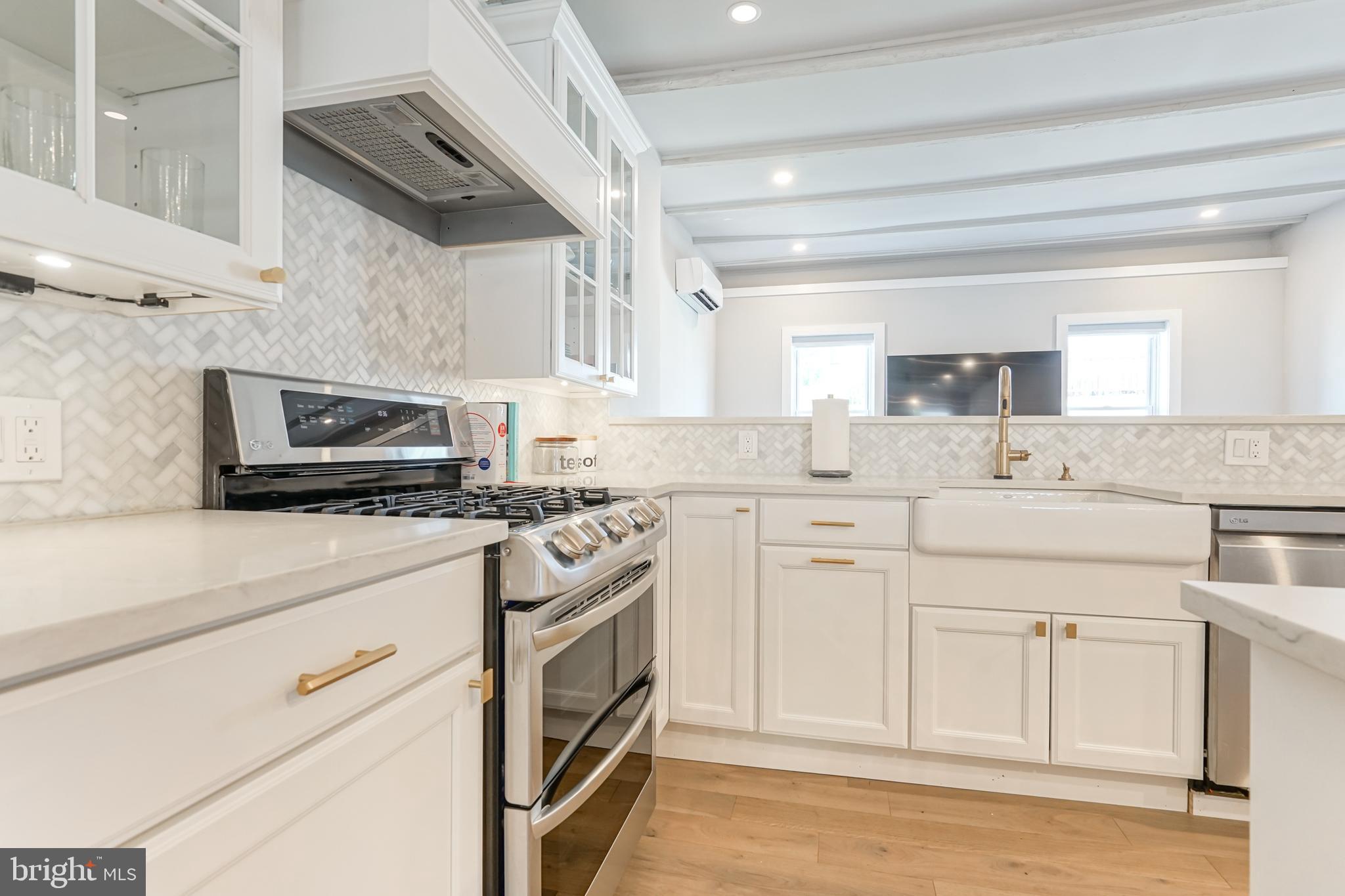 2314 South Street Philadelphia, PA 19146 - Photo 19 of 83 a kitchen with white cabinets and white appliances