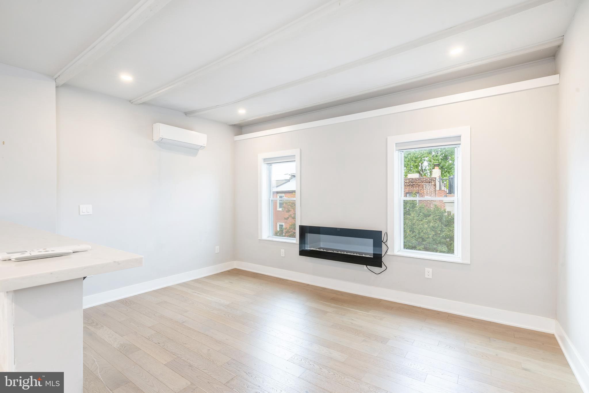 2314 South Street Philadelphia, PA 19146 - Photo 23 of 83 a view of an empty room with wooden floor and a window