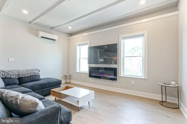 a white toilet sitting next to a white walls