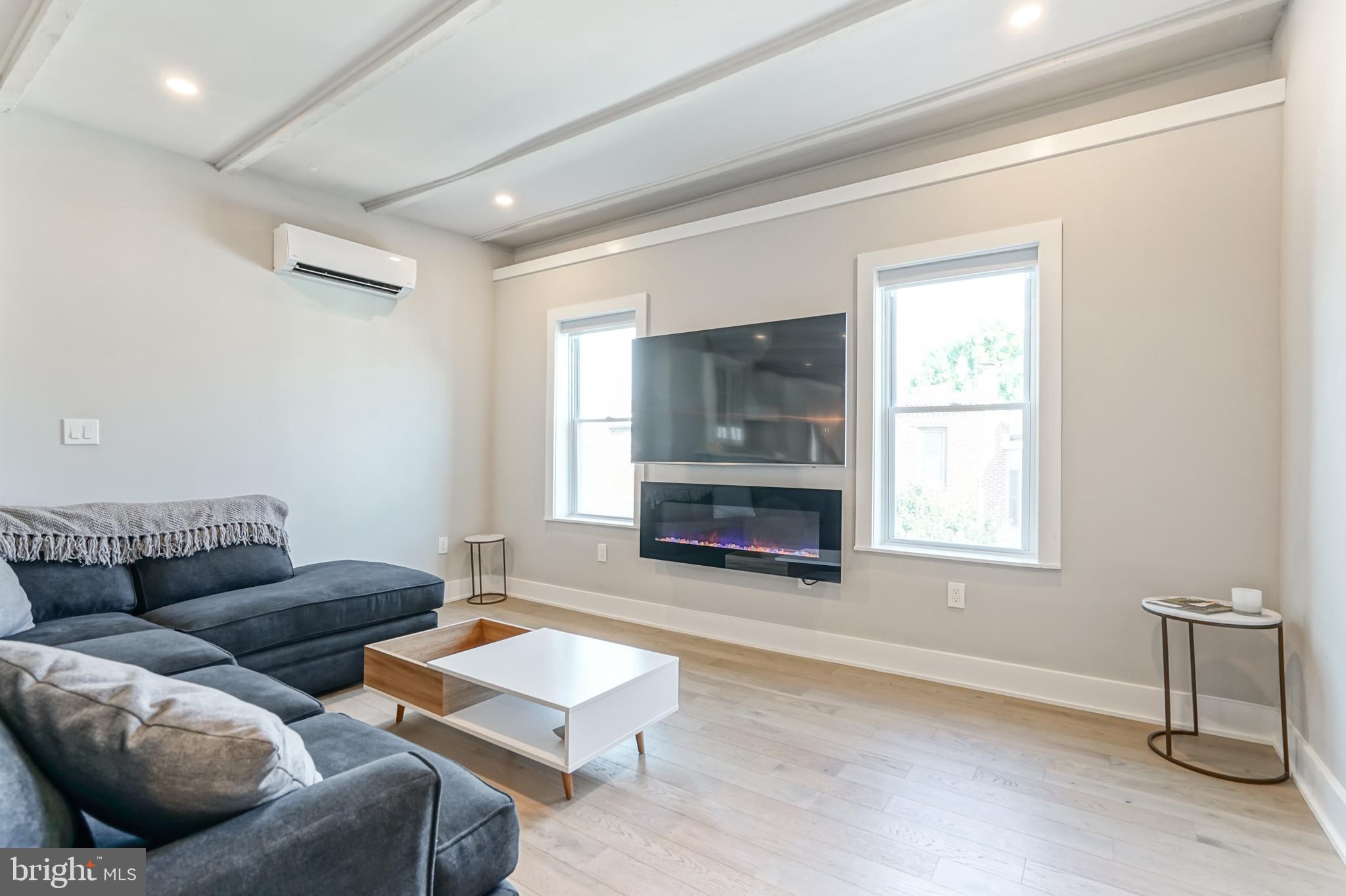2314 South Street Philadelphia, PA 19146 - Photo 30 of 83 a living room with furniture and a fireplace