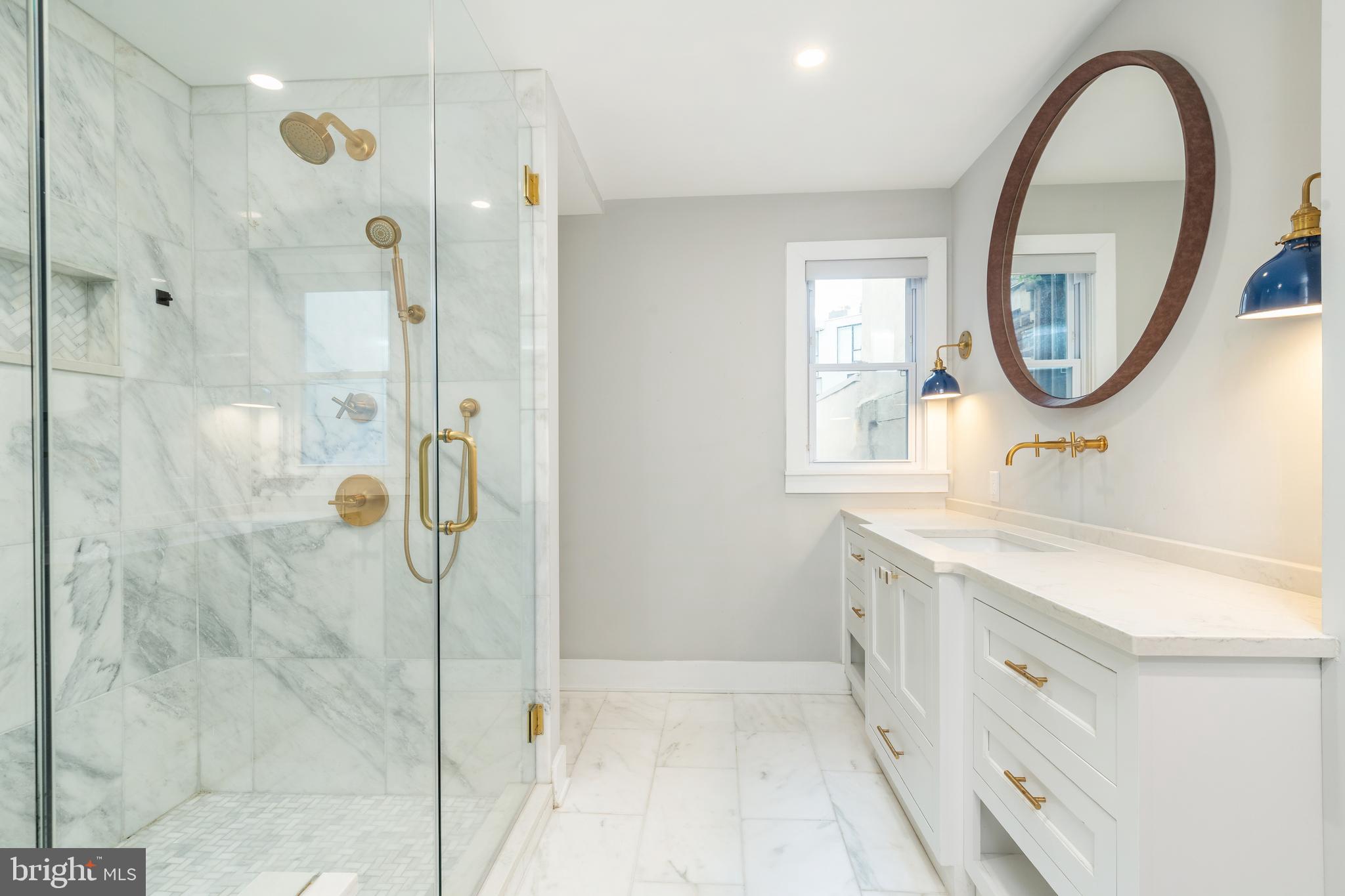 2314 South Street Philadelphia, PA 19146 - Photo 40 of 83 a bathroom with a double vanity sink mirror and shower