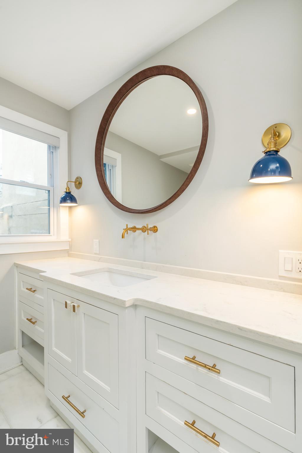 2314 South Street Philadelphia, PA 19146 - Photo 41 of 83 a bathroom with a sink and a mirror