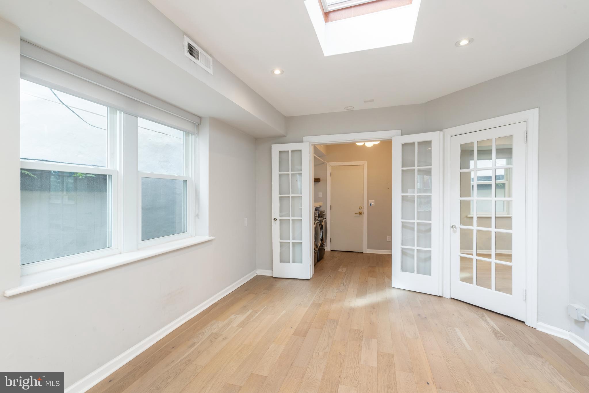 2314 South Street Philadelphia, PA 19146 - Photo 67 of 83 an empty room with windows