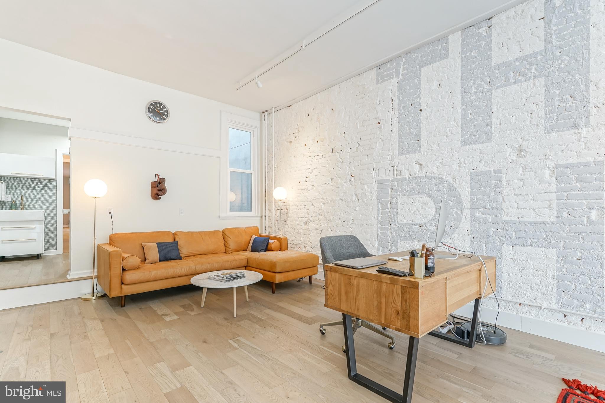 2314 South Street Philadelphia, PA 19146 - Photo 76 of 83 a living room with furniture and a wooden floor