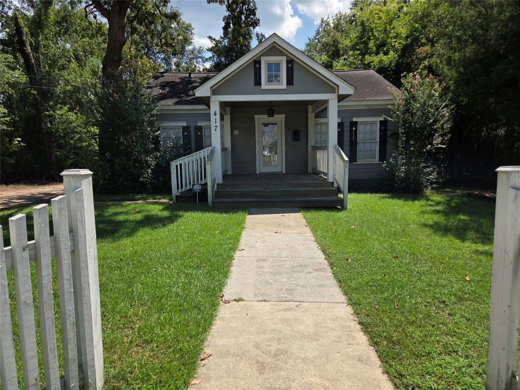 417 West Lewis Street Conroe, TX 77301 - Photo 11 of 11 a front view of a house with yard