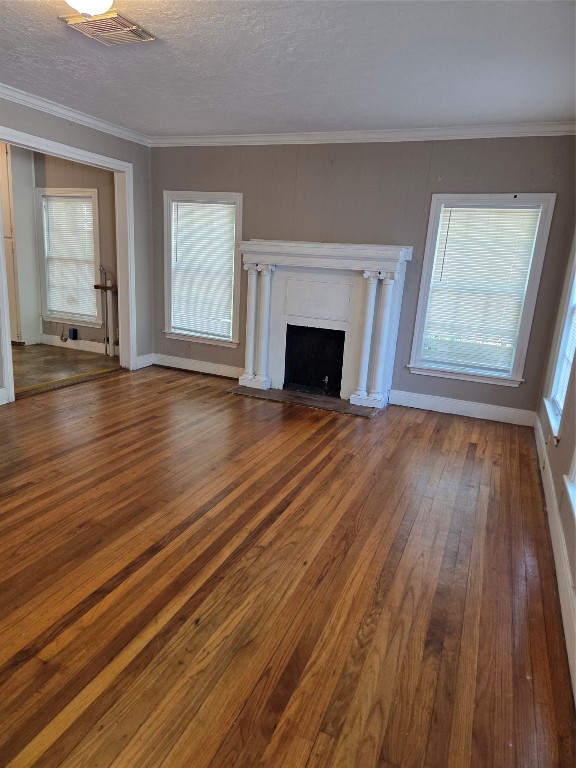 417 West Lewis Street Conroe, TX 77301 - Photo 2 of 11 wooden floor fireplace and windows in an empty room