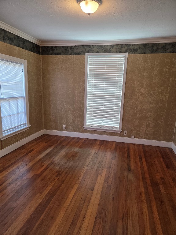 417 West Lewis Street Conroe, TX 77301 - Photo 3 of 11 a view of a room with wooden floor and windows