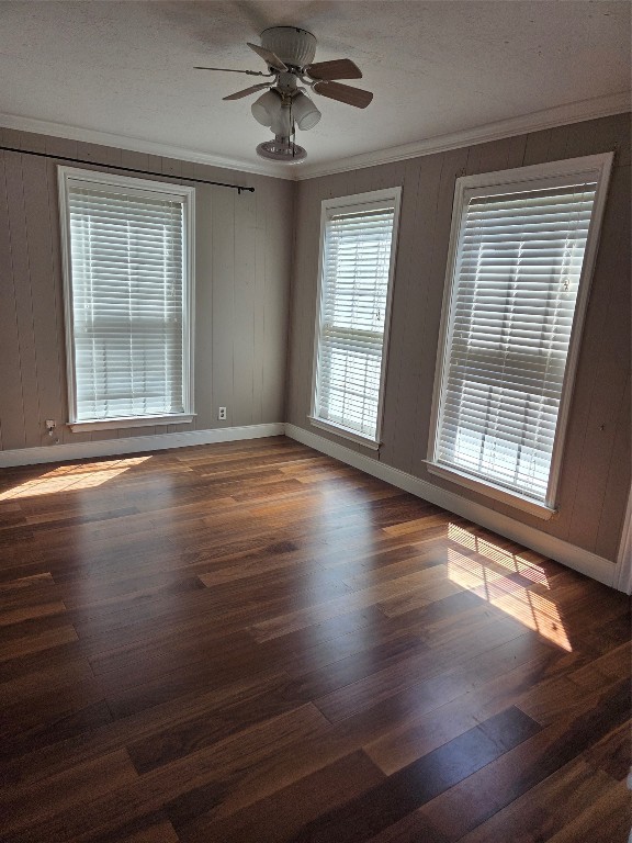 417 West Lewis Street Conroe, TX 77301 - Photo 4 of 11 a view of an empty room with wooden floor and a window