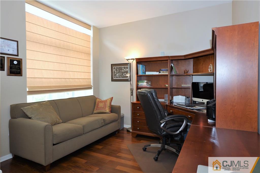 358 Rector Street, Unit 219 Perth Amboy, NJ 08861 - Photo 14 of 17 a living room with furniture and a window