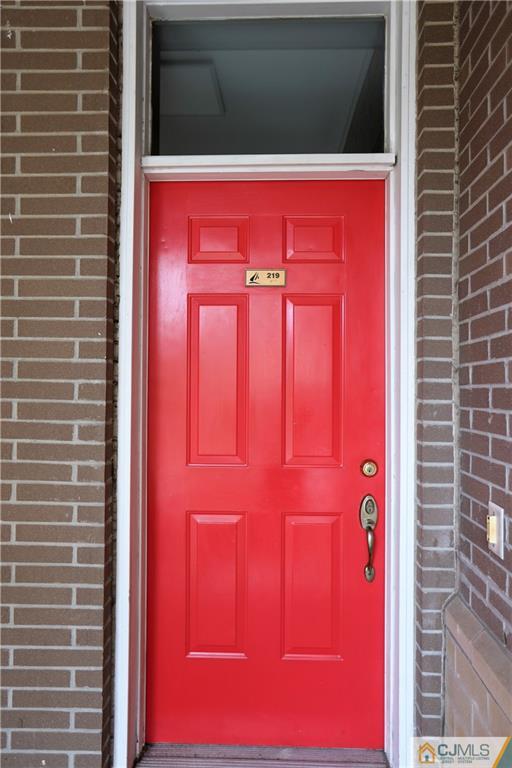 358 Rector Street, Unit 219 Perth Amboy, NJ 08861 - Photo 2 of 17 a view of a red door of the house