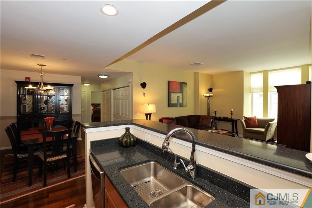 358 Rector Street, Unit 219 Perth Amboy, NJ 08861 - Photo 9 of 17 a kitchen with a sink and a large window