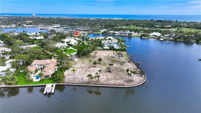 an aerial view of a house with a lake view