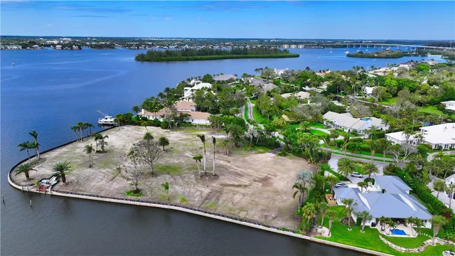 an aerial view of a house with a lake view