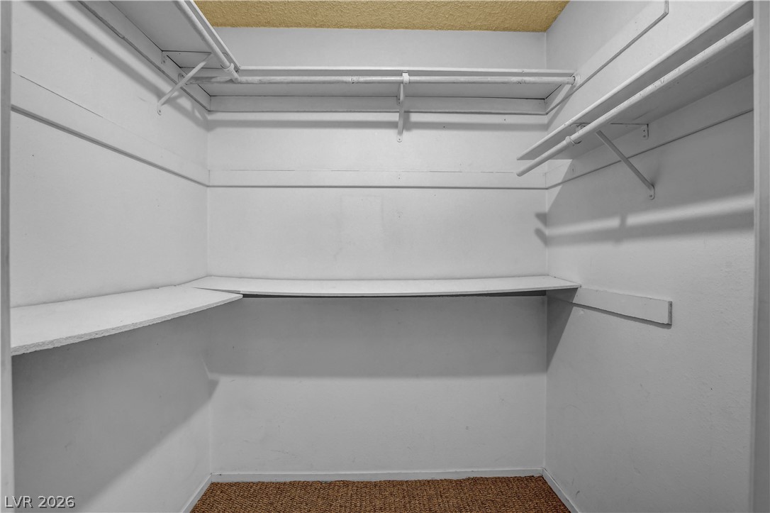 6440 Hartwood Road Las Vegas, NV 89108 - Photo 34 of 59 Ample shelving and hanging space offer organized storage for your wardrobe in this walk-in closet.