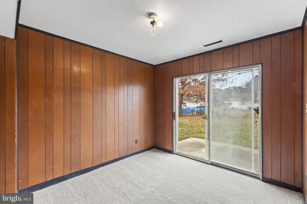 a view of an empty room with sliding door