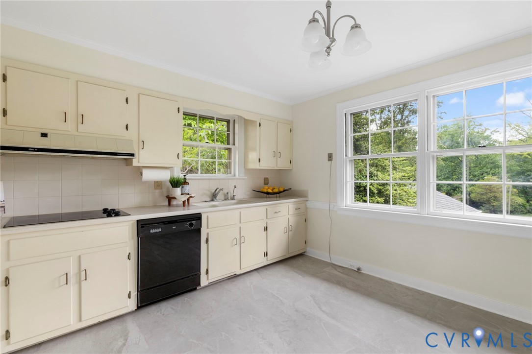 3140 Archdale Road Richmond, VA 23235 - Photo 11 of 48 a kitchen with cabinets appliances a sink and a window