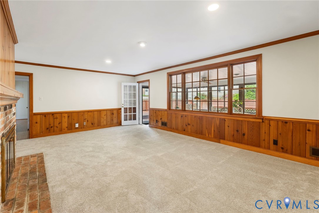 3140 Archdale Road Richmond, VA 23235 - Photo 15 of 48 a view of an empty room with a fireplace and a window