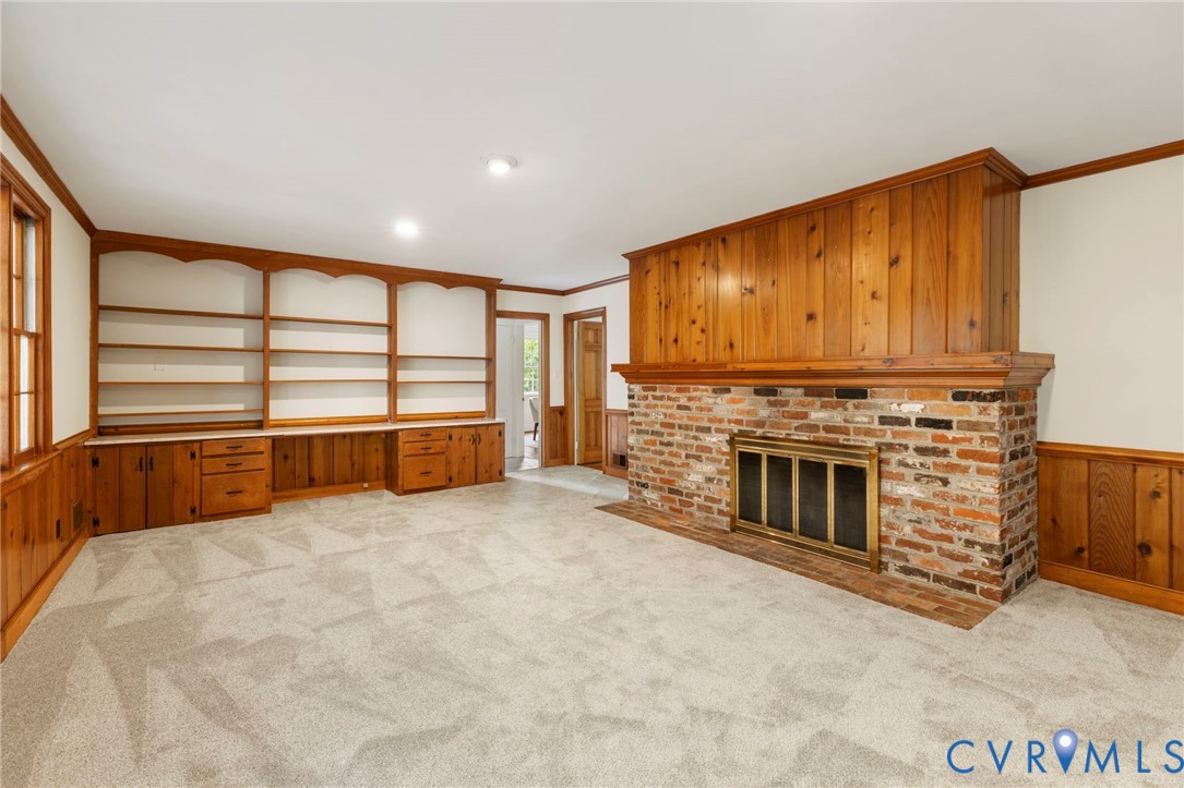 3140 Archdale Road Richmond, VA 23235 - Photo 17 of 48 a view of an empty room with a fireplace and a window