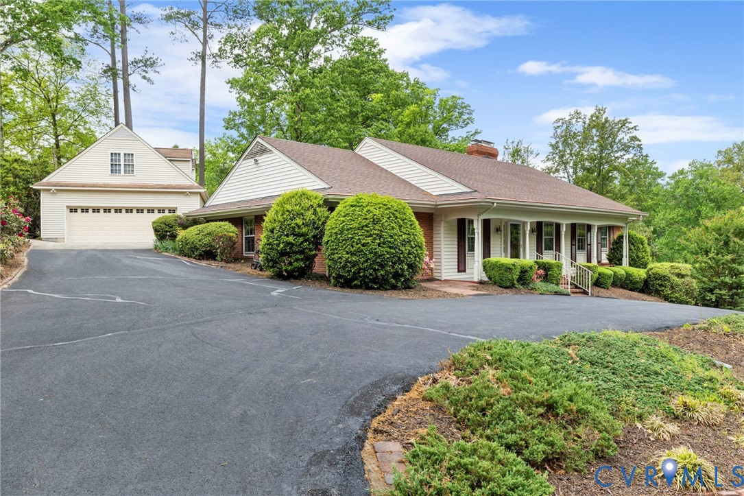 3140 Archdale Road Richmond, VA 23235 - Photo 2 of 48 a front view of a house with a yard and garage