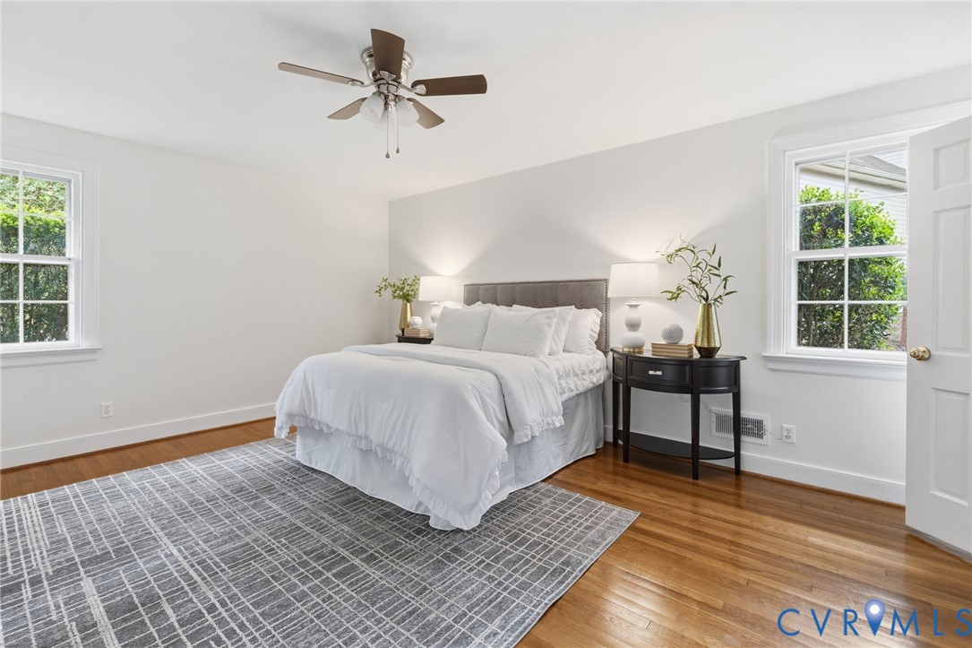 3140 Archdale Road Richmond, VA 23235 - Photo 22 of 48 a bedroom with a bed windows and a ceiling fan
